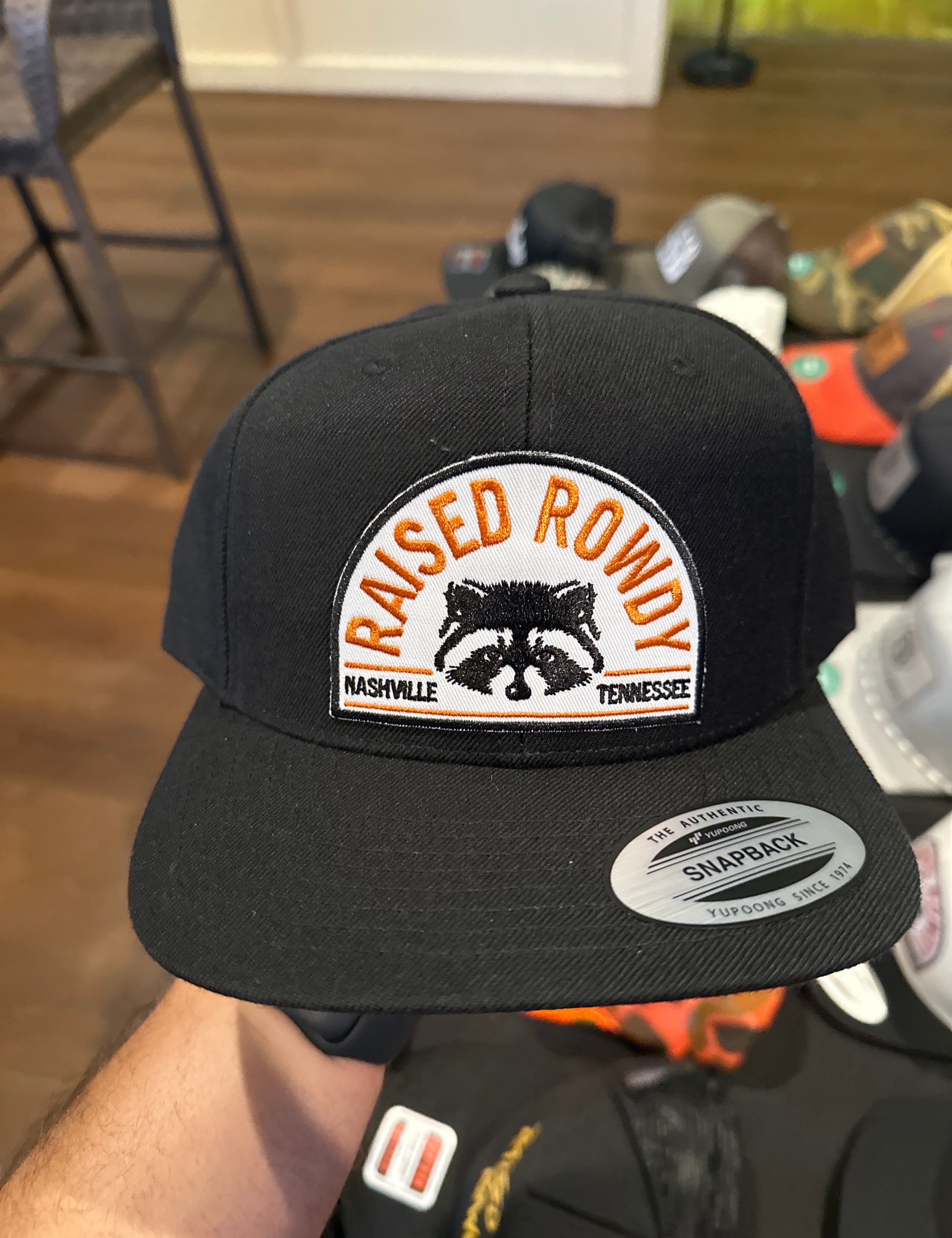 Raised Rowdy Raccoon SnapBack